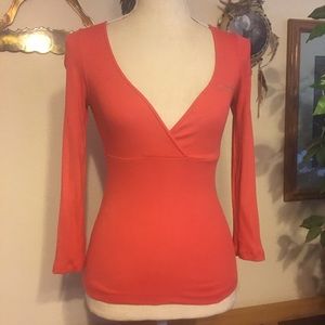Bebe rhubarb low cut v neck crystal “Bebe” top